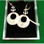 A pair of 18 carat and white gold diamond set earrings with jade hoops