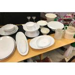 A collection of various cream/white glazed serving wares including White Company oval serving