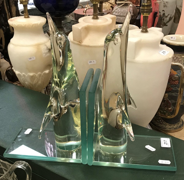 A pair of glass bookends as penguins