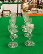 A set of eight 19th Century cordial glasses, the bowls decorated with symbols of the Empire, rose,