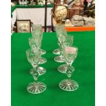 A set of eight 19th Century cordial glasses, the bowls decorated with symbols of the Empire, rose,