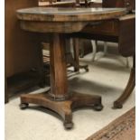 A Victorian rosewood pedestal card table of demi-lune form on a quadruped platform base