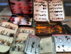 A Malloch's japanned fly tin and contents of various trout flies together with another similar