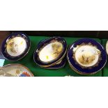 A collection of Royal Worcester game decorated dessert plates including circular plates and serving