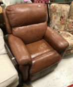 A modern brown leather reclining armchair
