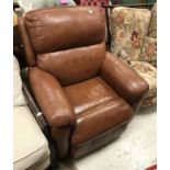 A modern brown leather reclining armchair