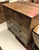 A 19th Century mahogany square-front chest of two short over three long drawers with knob handles,