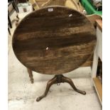 A 19th Century oak tilt top tea table,
