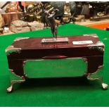 An early 20th Century mahogany box with silver golfing trophy mount bearing plaque inscribed "BB &