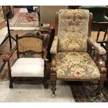 A Victorian open arm chair with floral upholstered arms raised on ringed and turned front legs to