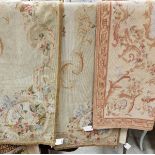 Three needlework panels in the Aubusson manner each with floral decoration,
