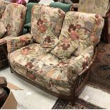 A modern three seater Ercol settee together with a matching two seat settee