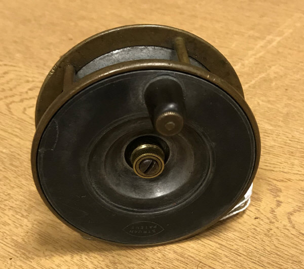 A Struan Patent alloy and brass fly reel,