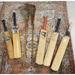 A collection of four various signed cricket bats including a Slazenger Geoff Boycott bat signed by