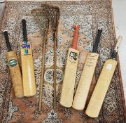 A collection of four various signed cricket bats including a Slazenger Geoff Boycott bat signed by