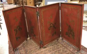 A circa 1900 red lacquered and gilt decorated Chinese four fold screen each panel decorated with