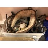 Two plastic crates and a box of various tack including heavy horse items,