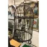 A modern wrought iron "bird cage" eight light electrolier