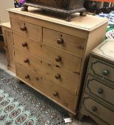 A pine chest of two short over three long drawers raised on turned feet