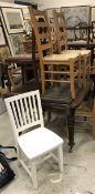 A set of six modern beech ladderback rush-seat kitchen chairs, a white painted chair,