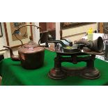 A brass-handled copper kettle, a set kitchen scales and weights,