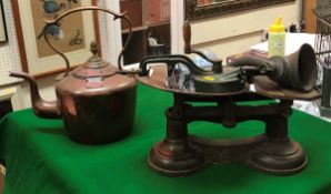 A brass-handled copper kettle, a set kitchen scales and weights,
