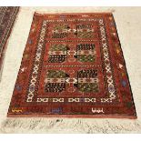 A modern Persian design rug with repeating medallion decoration on a red ground,