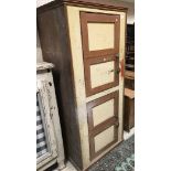 A 19th Century painted pine kitchen cupboard with twin-panelled door over a further twin-panelled