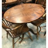 Two modern oak circular pedestal tripod tables in the 18th Century manner