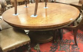 A Victorian mahogany circular breakfast table on pedestal support to lion's paw feet (replacement