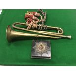 A brass trumpet inscribed "Second L.