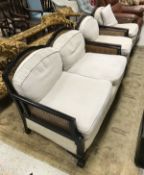 A circa 1900 Bergere two seat sofa together with two matching armchairs and a Victorian child's
