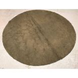 A modern circular rug of plain taupe colour, approx.