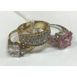 Three nine carat gold stone set dress rings