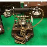 An early 20th Century Swedish oak-cased telephone with integral bell by Karlsens Elektriske