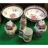 A Chinese armorial ware fruit bowl with all over floral decoration,