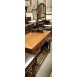 A modern Chinese cherry wood desk together with a rosewood and brass standard lamp (polescreen