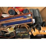 A box containing assorted telescopes,