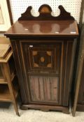 An Edwardian mahogany and inlaid music cabinet,