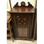 An Edwardian mahogany and inlaid music cabinet,