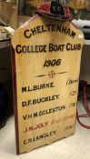 A painted wooden sign "Cheltenham College Boat Club 1906" detailing six rowers