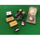 A collection of ornamental wares to include a pair of childs leather shoes,