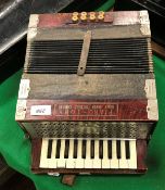 A Ludwig accordion "Piano-Tone Down South Tremolo Concert" in simulated rosewood case
