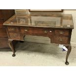 An early 20th Century burr walnut veneered lowboy in the 18th Century manner,