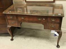 An early 20th Century burr walnut veneered lowboy in the 18th Century manner,