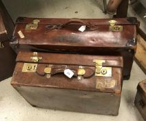 A leather suitcase by A.