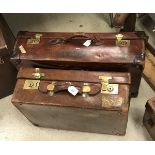 A leather suitcase by A.