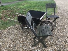 A vintage wooden wheelbarrow together with two wooden folding chairs