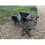 A vintage wooden wheelbarrow together with two wooden folding chairs