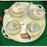 A Limoges rose and gilt decorated tête-à-tête teaset (no jug) on an associated two handled tray